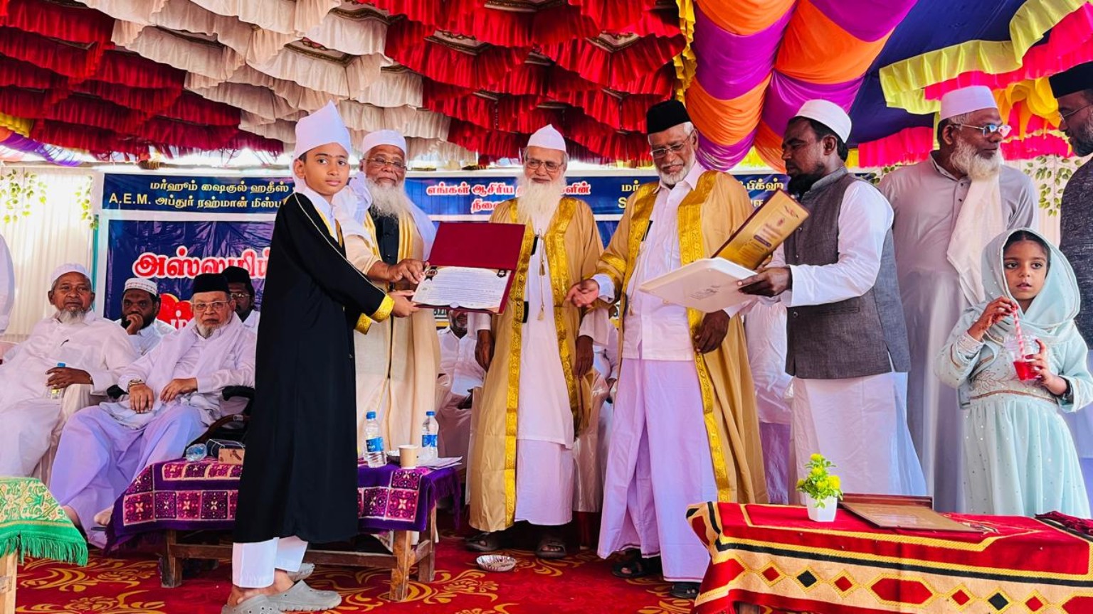 Hifz student receiving a certificate at graduation